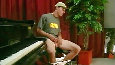 Brunette twinks her pussy with her black baseball cap while riding