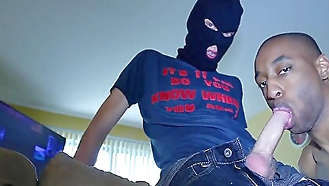 A black skater with a white mask is riding on a white skunk